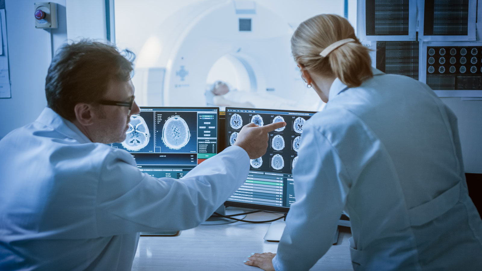 Group of radiologists viewing an image on a computer monitor